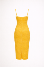 Yellow dress with thin straps on a white background